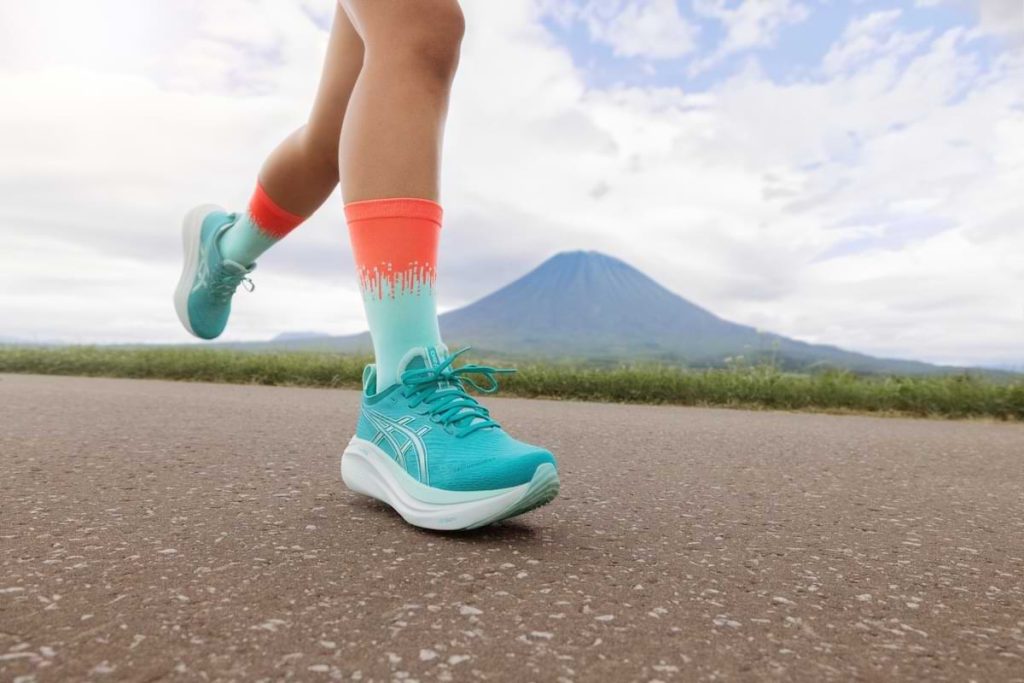 ASICS GEL-NIMBUS 27 on a woman running closeup on feet
